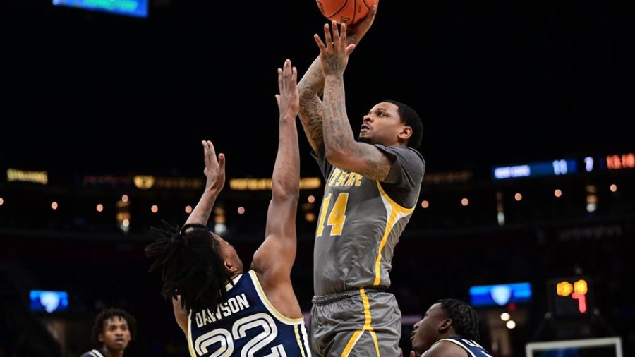 Redshirt senior forward Tervell Beck goes up for a shot during the Kent State mens basketball teams loss to Akron in the MAC Championship on Saturday, March 12 in Cleveland, Ohio.