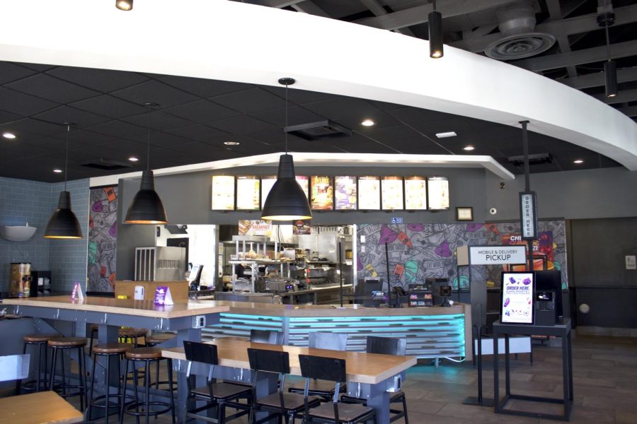 Taco Bell on 805 E Main St. Pictured is the inside, the front counter, and an ordering kiosk.