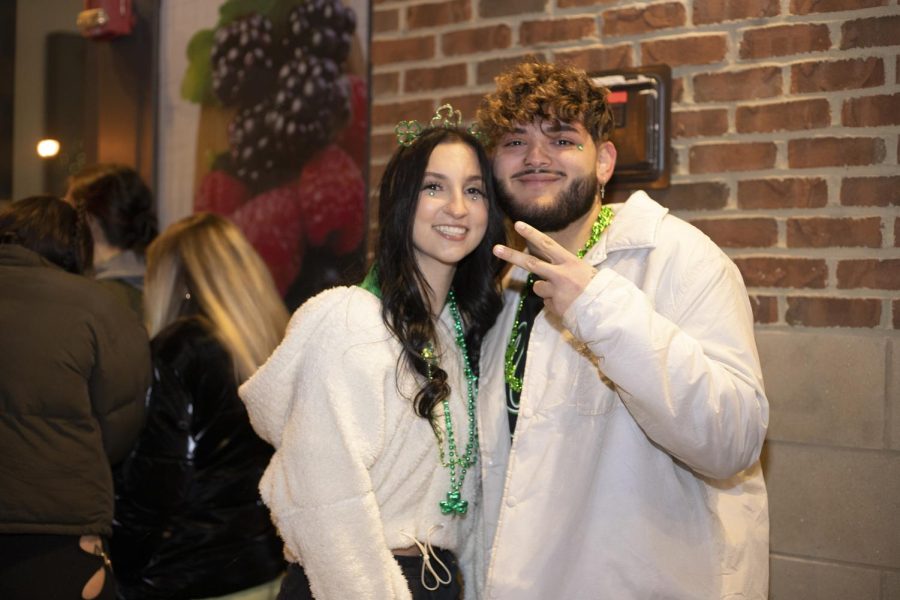 Public health major Megan Torres (left) waits in line for Barfly with her boyfriend Dylan Baker on Fake Paddys Day. 