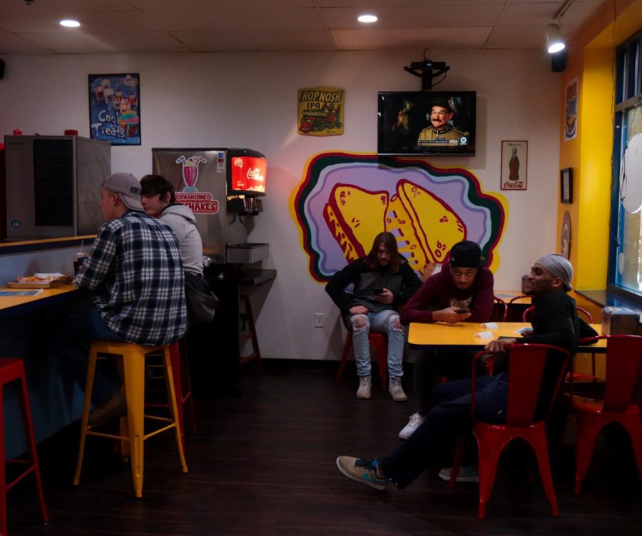People sit inside Twisted Meltz located in acorn alley in downtown Kent.