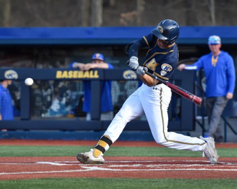 Kent State sophomore Kyle Jackson swings for the ball.