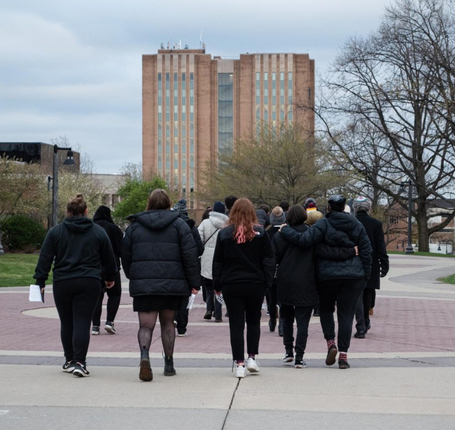 The Yom HaShoah attendees walk across campus to the MACC Center.