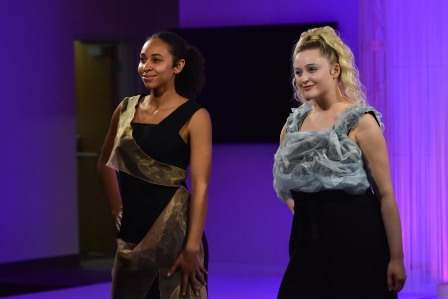 Two Kent State students model a pair of dresses during the annual fashion show on April 28, 2022.