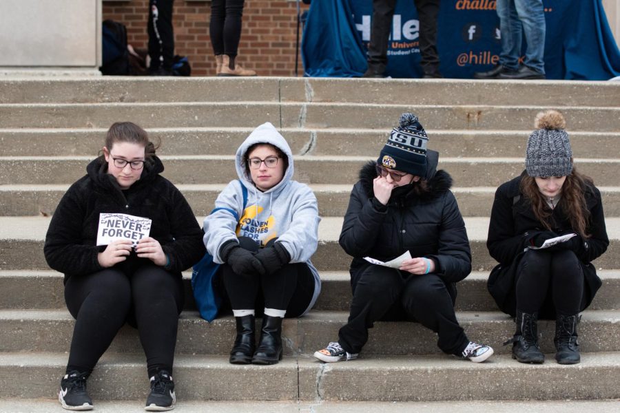 Yom Hashoah attendees hunker down on the MACC steps for the 24-hour name reading.