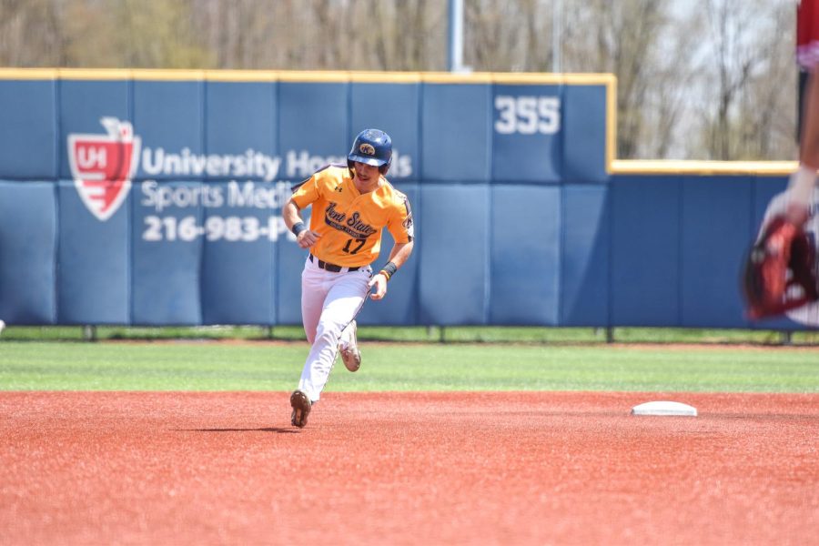 Kent State junior Mack Timbrook makes a break for third base.