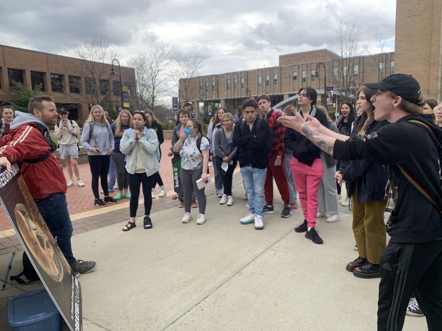 Senior digital media production major Andrew Suttman debates Seth Drayer, the vice president of Created Equal. The nonprofit organization held an anti-abortion protest today on the K at Risman Plaza.