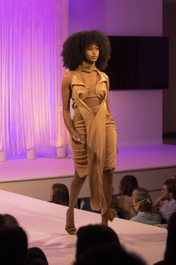 A Kent State student models DAntae Butler collection during the annual fashion show on April 28, 2022.