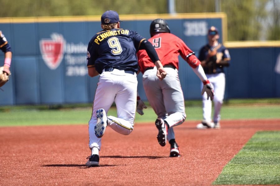 Kent State junior Payton Pennington chases down the opposing teams runner to tag him with the ball. 