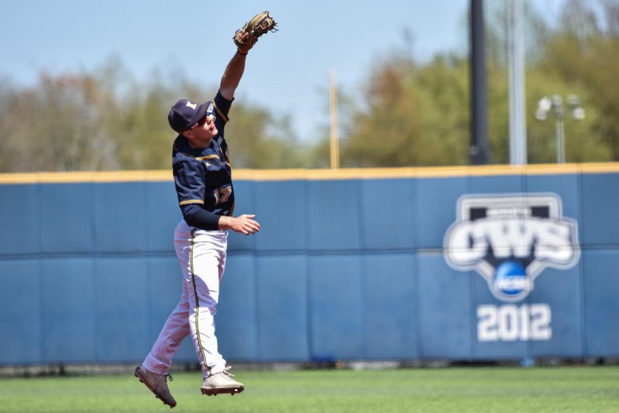 Kent State junior Mack Timbrook leaps to catch a high ball during the game on May 8th, 2022. 