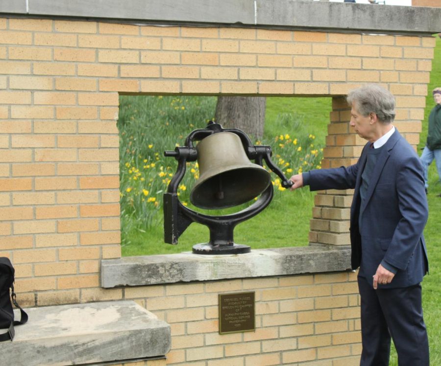 Picture from the May 4, 2022 ceremony commemorating the fifty-second anniversary of the Kent State massacre. Kent Alumni Tom Grace ringing the bell.