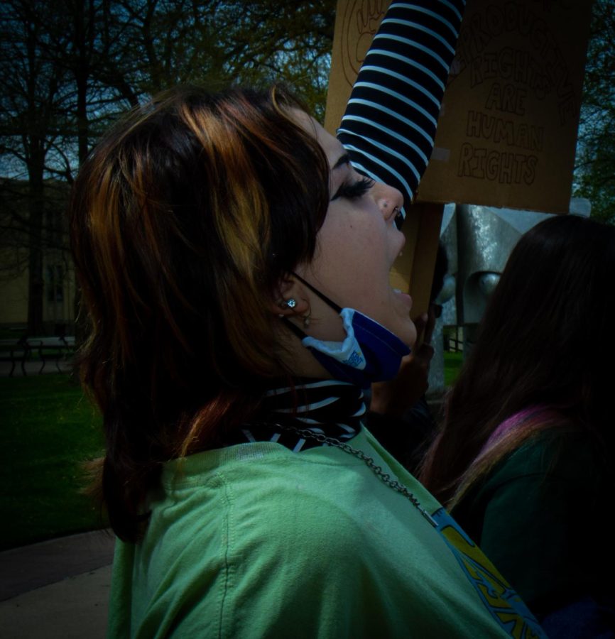 A Kent State student marches with the large crowd for pro-choice rights on Thursday, May 5.