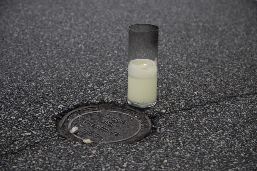 A candle was placed next to Douglas Alan Wrentmores marker of where he was shot during the May 4 shooting at Kent State University. 