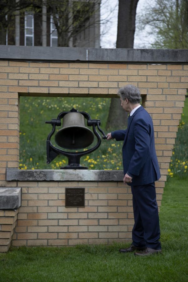 Kent State Alumni Thomas Grace rings the Victory Bell during the commemoration on May 4, 2022. The commemoration took place in the Student Commons. 