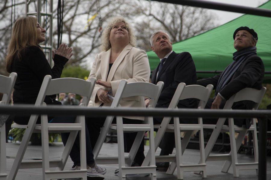 (From left to right) Roseann Chic Canfora, Provost Melody Tankersley, Jon Meacham and President Todd Diacon watch a video during the May 4 Commemoration on May 4, 2022. 