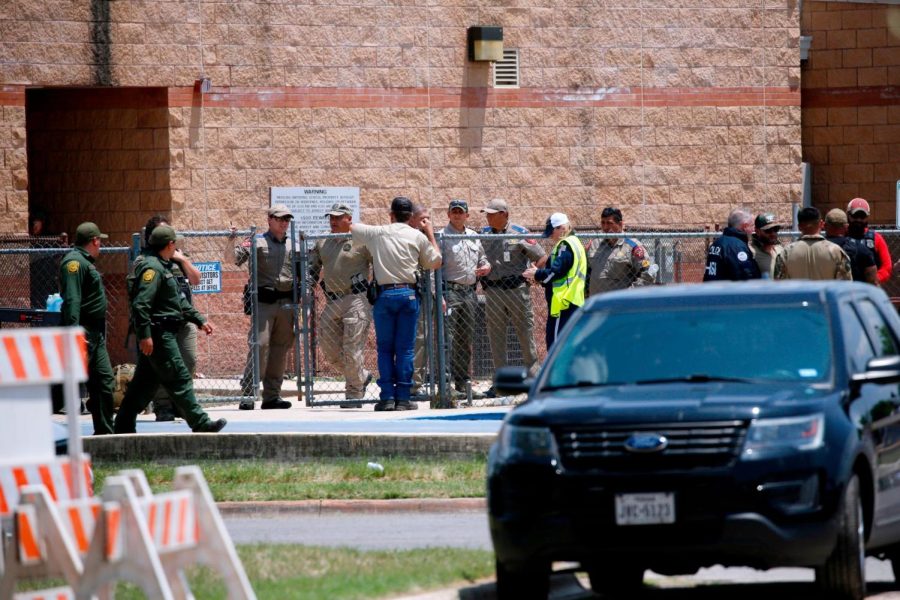 Law enforcement, and other first responders, gather outside Robb Elementary School following a shooting on May 24 in Uvalde, Texas.
