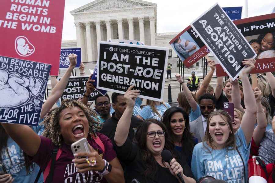 Demonstrators+gather+outside+the+Supreme+Court+in+Washington%2C+Friday%2C+June+24%2C+2022.+The+Supreme+Court+has+ended+constitutional+protections+for+abortion+that+had+been+in+place+nearly+50+years%2C+a+decision+by+its+conservative+majority+to+overturn+the+courts+landmark+abortion+cases.+