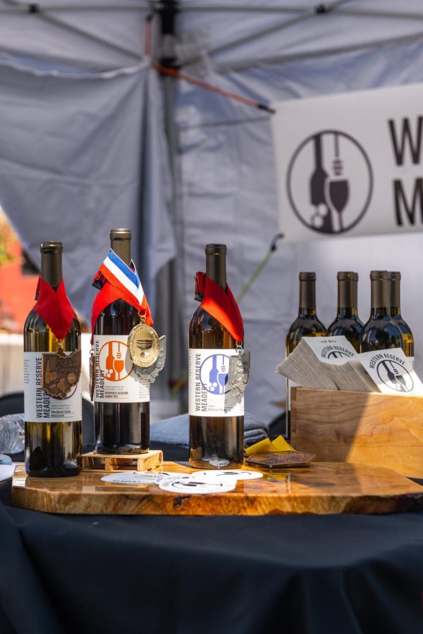 Western Meadery displaying wines for tasting during the Art and Wine Festival on June 4, 2022. The bottles displayed are adorned by the awards they have won in various competitions.
