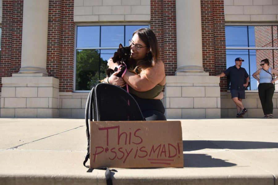 Marie Comi and her cat Molly sat on the steps of the Kent Municipal Courthouse on June 24 in support of the protest hosted by SDS.