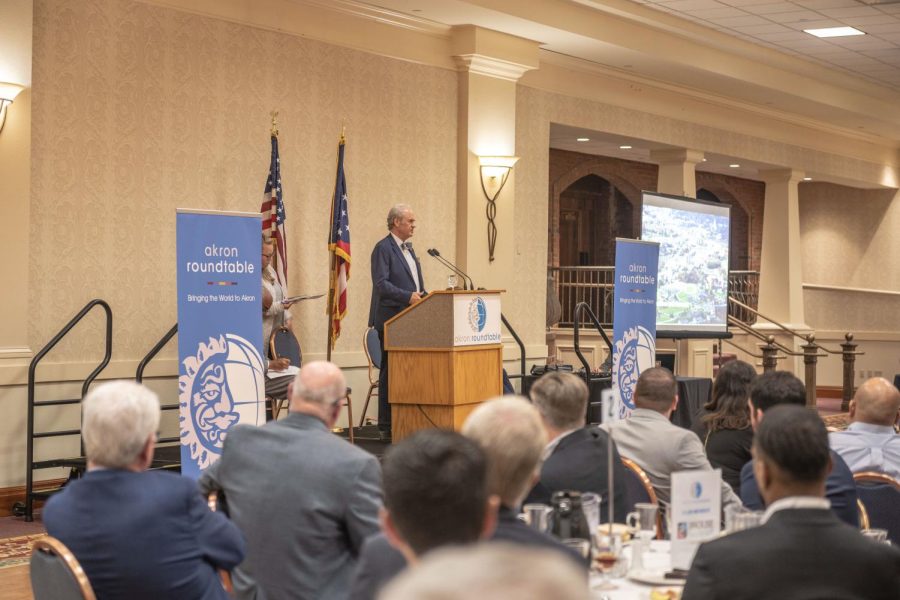 Kent State University President Todd Diacon speaking at Quaker State Catering Center for the Akron Roundtable luncheon on June 16, 2022. Diacon told listeners about the third wave economic change in education funding and access.