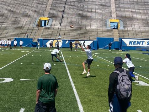 A Kent State Football Ohio Mega Camp attendee gets ready to catch a throw.