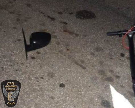 A photo from the scene of a fatal crash that killed Kent State student Colin Pho on Summit Street near Dix Stadium. It shows a broken car mirror and part of the scooter Pho was riding when he was struck from behind August 22 around 9 p.m.