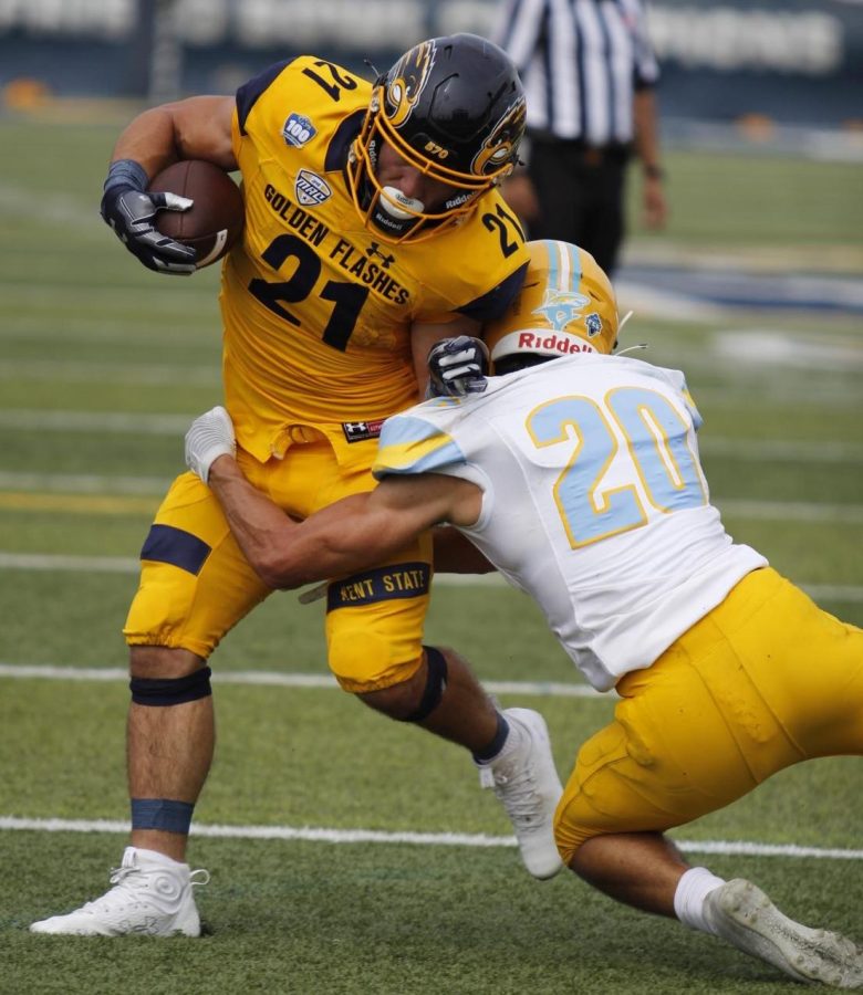 Kent State running back Gavin Garcia, who is now a sophomore on the team, breaks a tackle during his run downfield Sept. 17, 2022 against Long Island. Kent State won the match 63-10. 