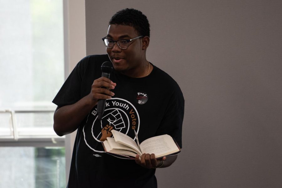 Akii Butler reads a few pages from J. K. Rowlings Harry Potter during the second annual Banned Book Reading.