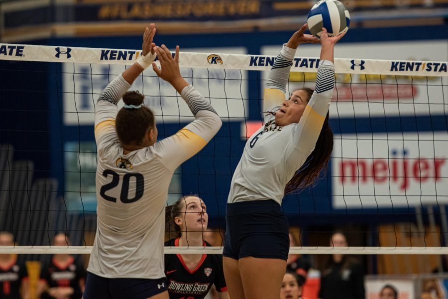 Kent State graduate student Alex Haffner (right) sets the ball for Danie Tyson (left).