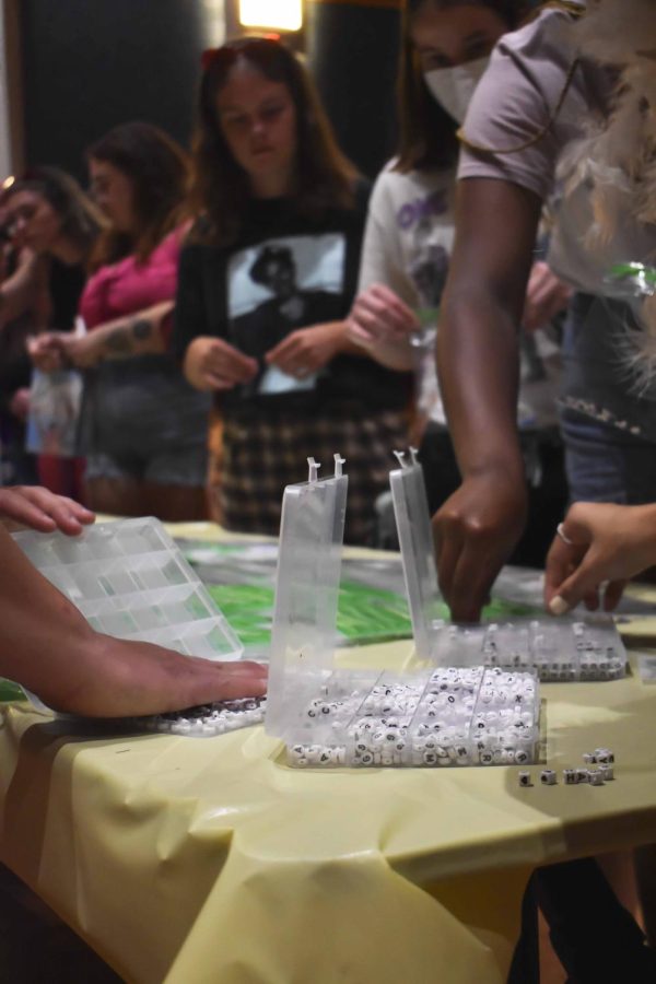 Students enjoy creating beaded jewelry, snacks, and music at the Harry Styles listening party on Sept. 10, 2022.