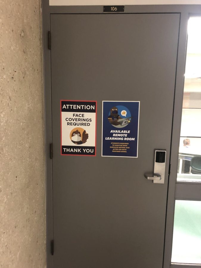 A room in the Business Administrative Building still has a Face Covering Required sign posted on the outside of the door even after the university ended their mask mandate.