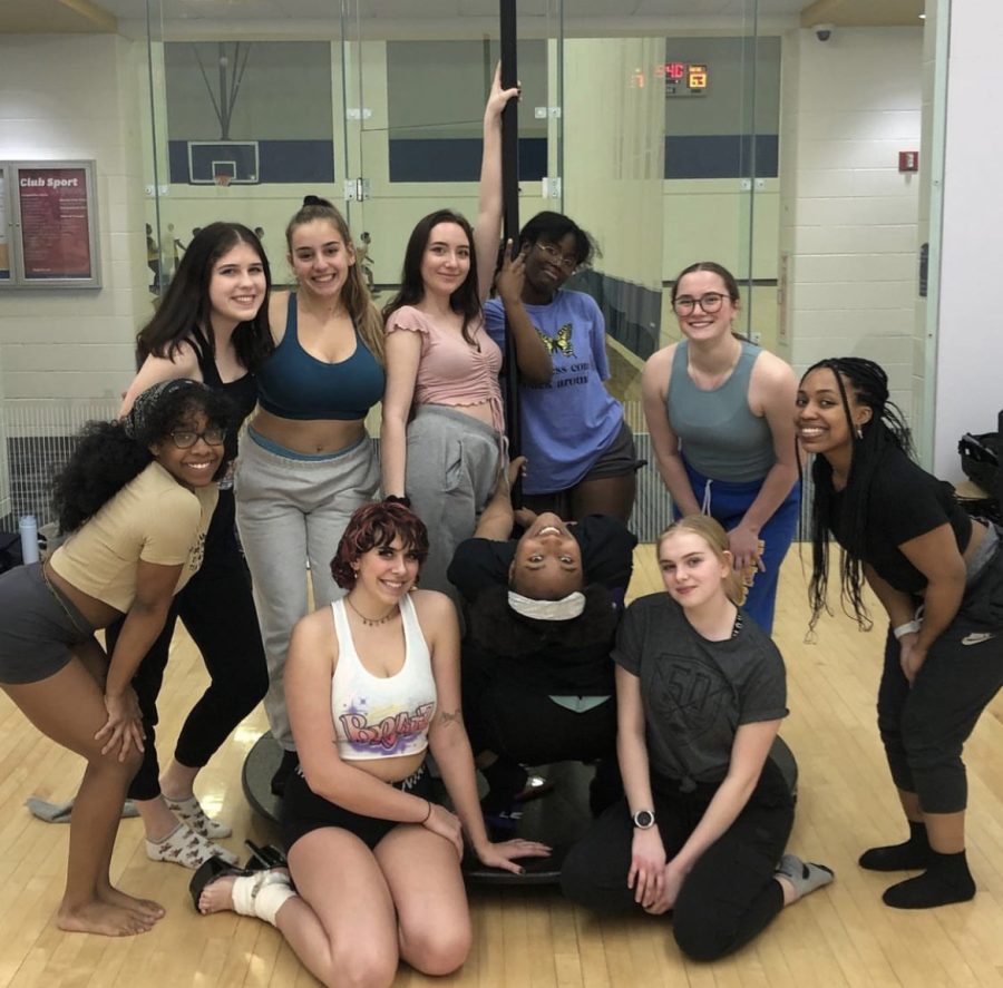 The Flash Pole Fairies and students pose after a successful pole session.