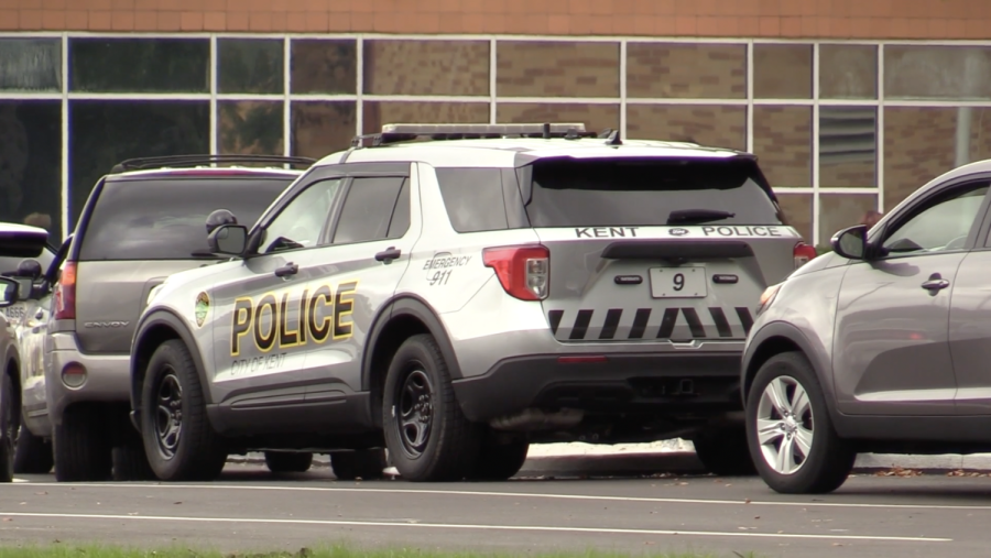A police car sits outside Theodore Roosevelt High School in Kent following the second threat to a school in the district in less than a week.