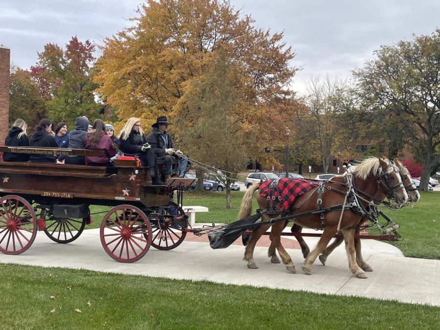 A horse carriage took students on a tour through campus.