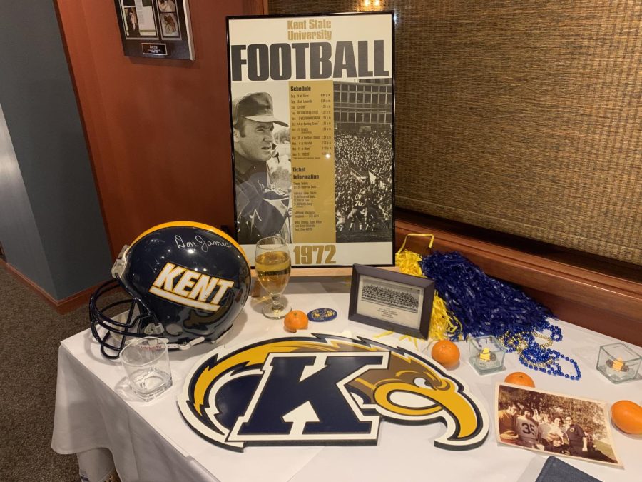 A table at the Kent State 1972 championship football team reunion at Laziza in downtown Kent featured the 72 football schedule and a helmet signed by then-coach Don James. The tangerines celebrated the teams appearance in the programs first bowl game that year.  