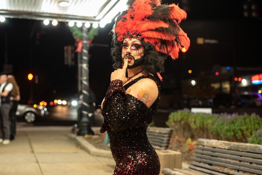 Danielle Attme keeps the line entertained outside of The Kent Stage. Attme encouraged people to go to local drag and burlesque shows.