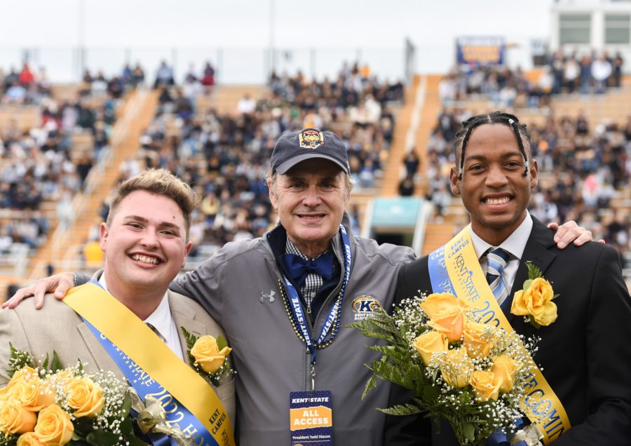 The 2022 Homecoming Royalty Gavin Aitkin and Quintin Cooks pose for a photo with President Todd Diacon. The men recieved a lot of cheers by the crowd when their names were announced.