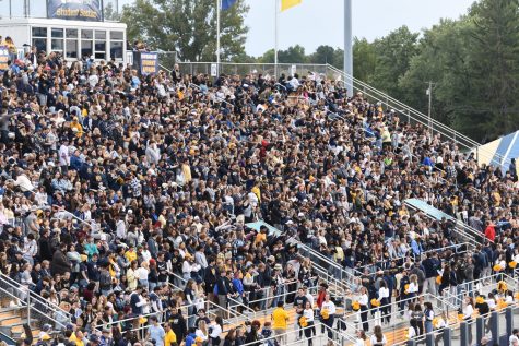 The Kent State Student Section cheers on the Golden Flash football team during the Homecoming game. The men won against Ohio University 31-24.