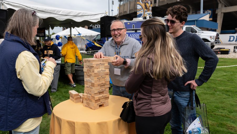 Chuck Mozingo and his family play a game of Jenga before the game. Mozingo, a Kent State alumnus, had a great time at his old university.