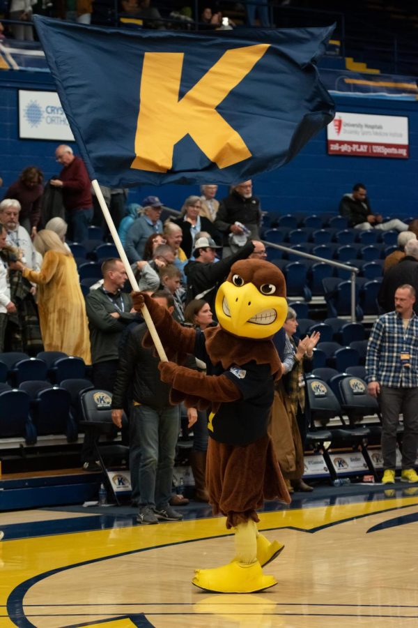 Flash the Golden Eagle waves a flag to celebrate the mens basketball teams victory over Portland University on Nov. 14, 2022.
