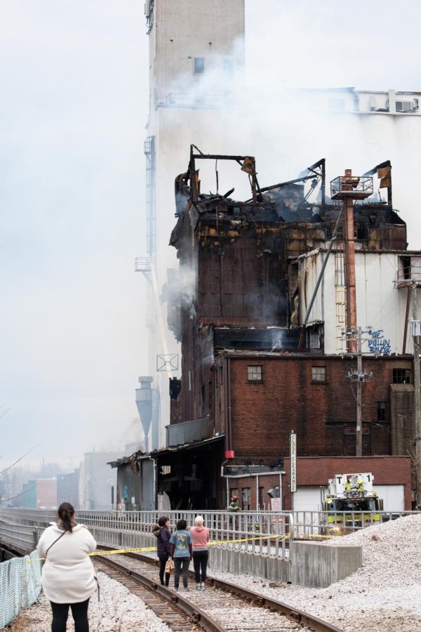 Several hours after the initial blaze, the burnt mill building continued to smolder. 