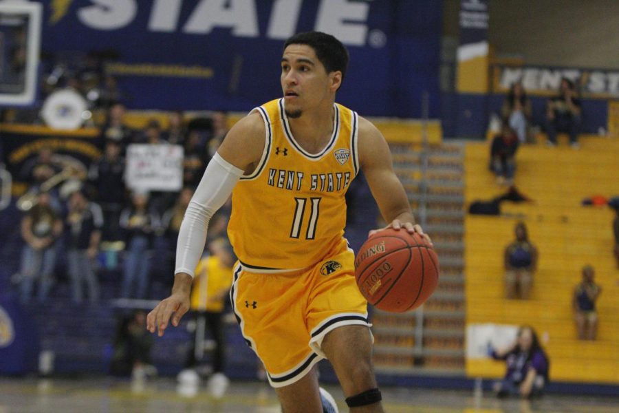 Kent State redshirt junior Giovanni Santiago dribbles the ball down the court during the game against South Dakota on Dec. 2nd, 2022.
