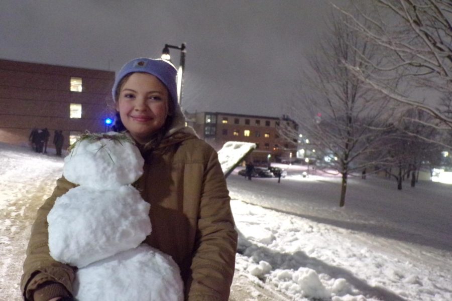 Student poses with her portable snowman at Kents 2023 snowball fight.