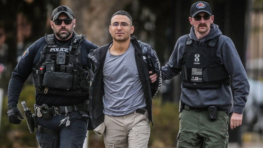 Peña is taken into custody Monday by police in Albuquerque. Roberto E. Rosales/Albuquerque Journal/Zuma Press Wire/Newscom