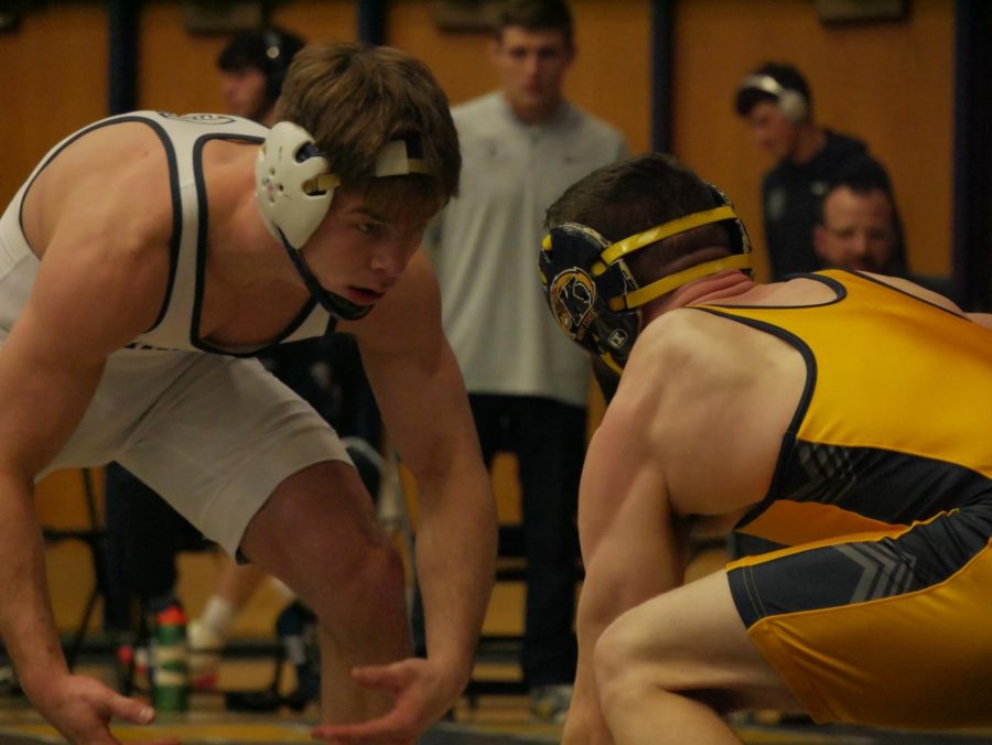 Kody Komara (Gold) squares off with Kyle Schickel (white) during Kent States contest against Clarion Jan. 29.