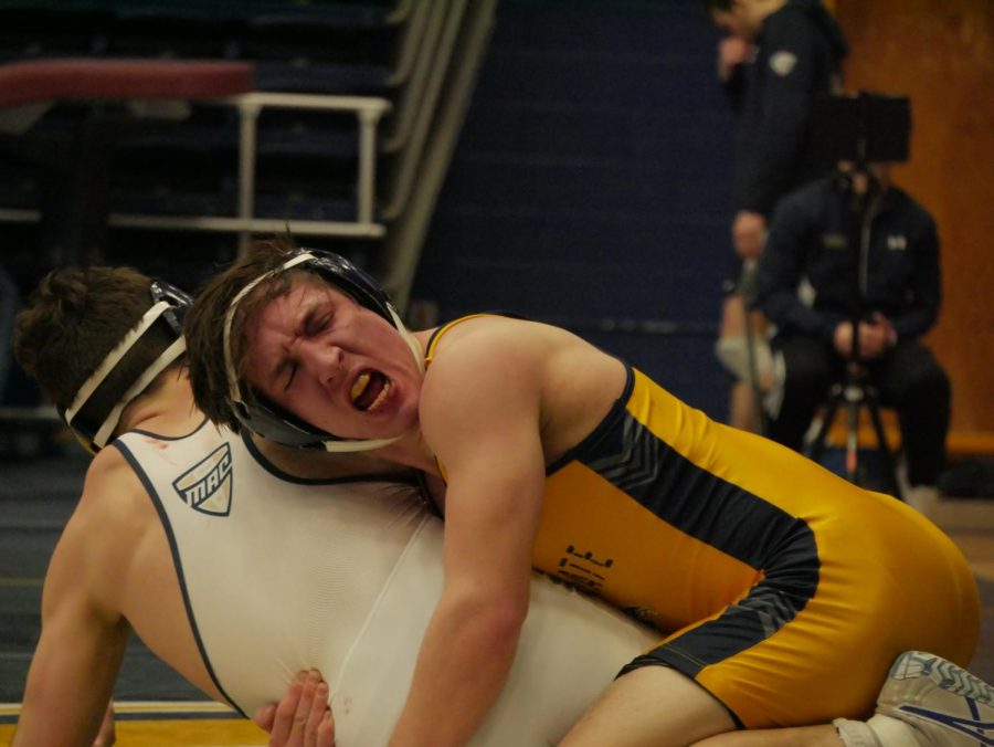 Keegan Knapp (Gold) cheers after regaining control from opponent Trevor Elfvin (White) during Kent States matchup against Clarion Jan. 29, 2023.