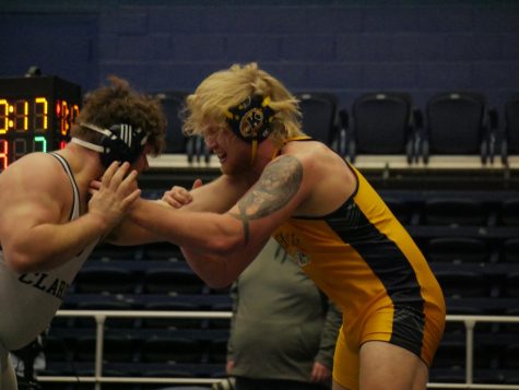 Jacob Cover (Gold) and Austin Chapman (White) during Kent States matchup against Clarion on Jan. 29.