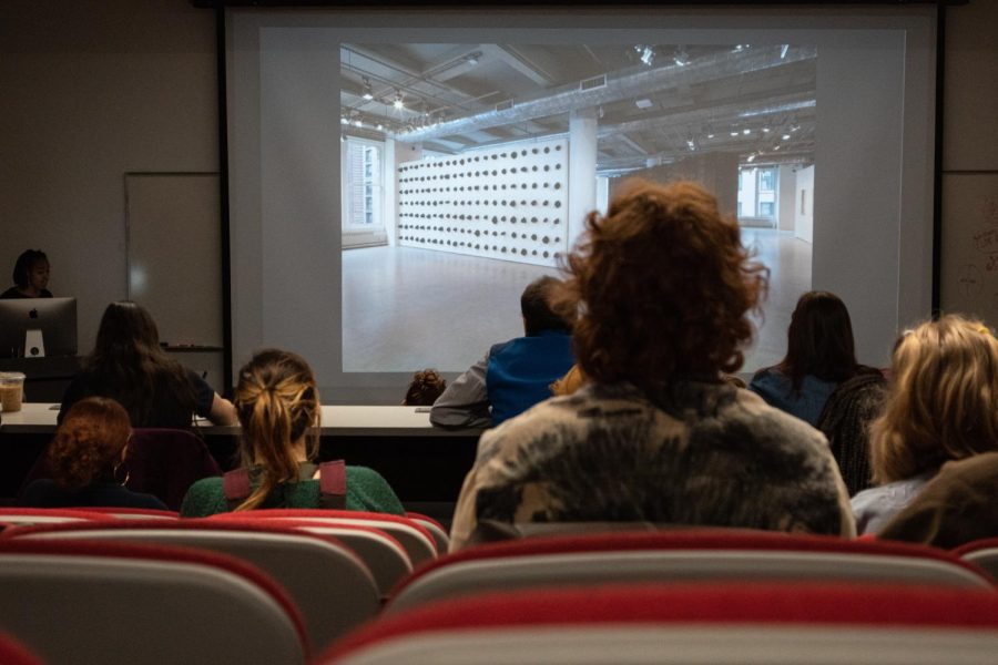 Audience members listen intently as Nneka Kai speaks on some of her works during the presentation on Jan. 20, 2023.