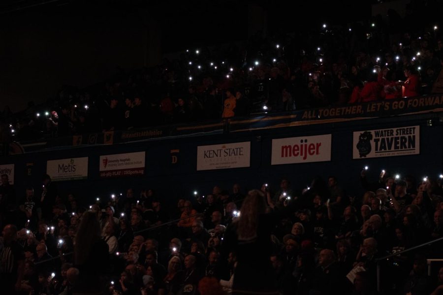The lights go down and the flashlights come out as Golden Flash fans cheer while the players take to the court during the game against BSU on Jan. 20th, 2023.