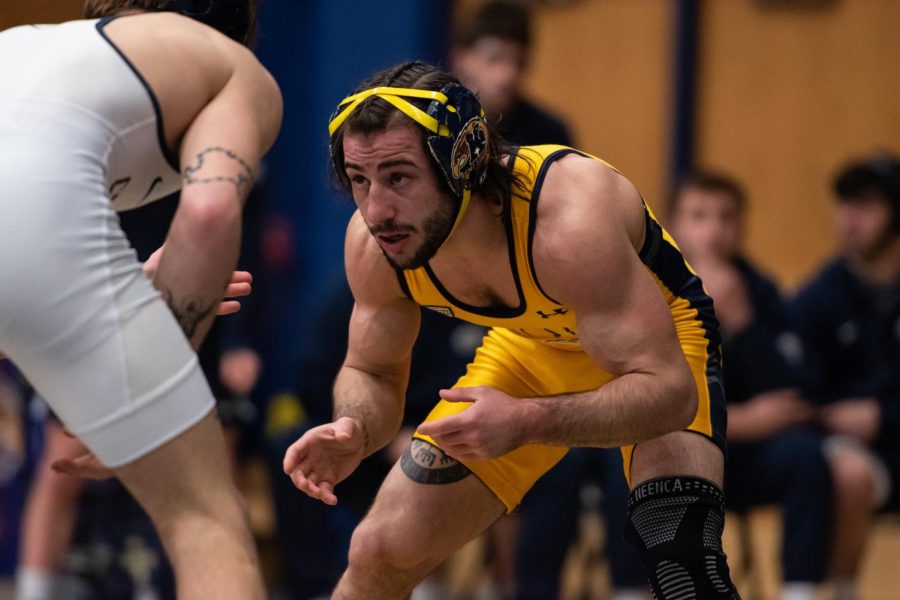 Kent State graduate student Jake Ferri faces off against Clarion University sophomore Joey Fischer on Jan 29.