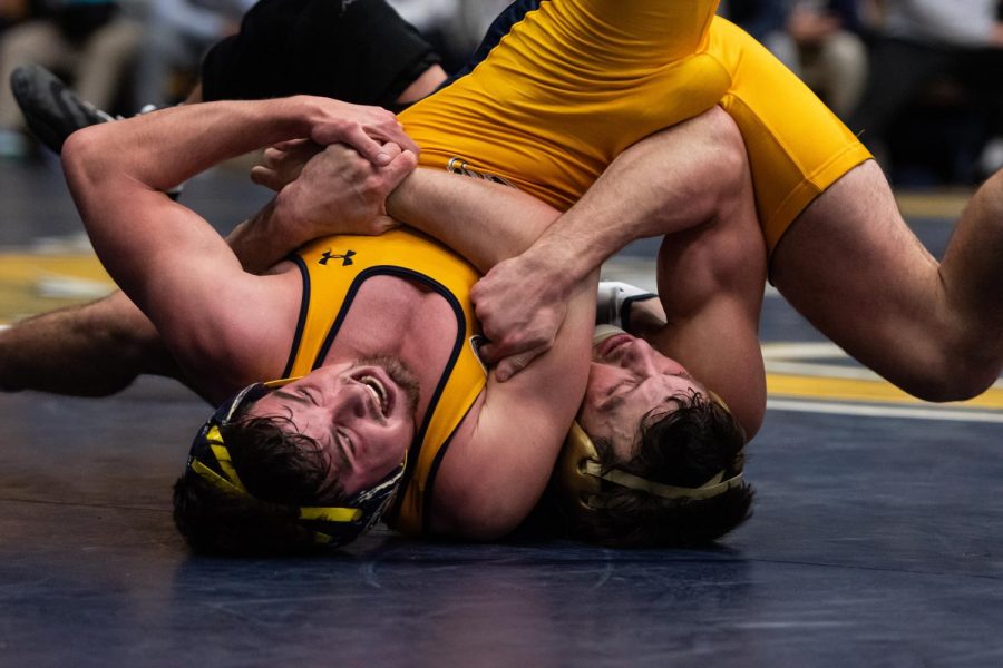 Kent State freshman Colby Dalon fights to escape Clarion University redshirt junior Cam Pines hold on Jan. 29.